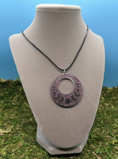 Cutout Circle Pendant with Black Moons